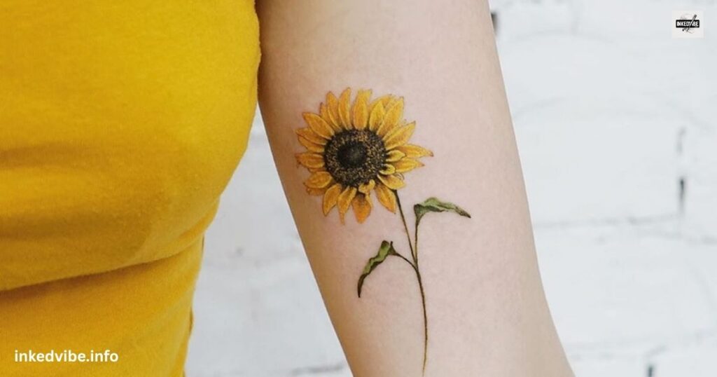 A Subtle Coloration: Charming Sunflower Tattoo On Thigh