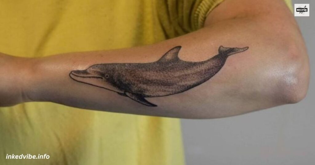 Beam Of Cuteness: Vibrant Cartoon Dolphin Tattoo